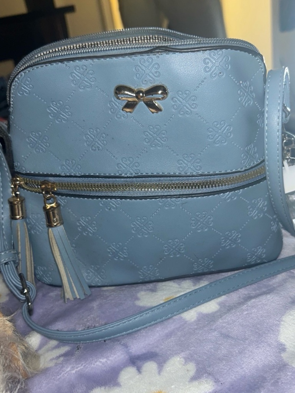 Blue Quilted Crossbody Bag with Gold Bow Accent